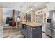 Modern kitchen with stainless steel appliances, granite countertops, and a center island at 904 Beaumont Ct, Canton, GA 30114
