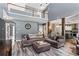 Open-concept living room with high ceilings, a large sofa, and wood floors at 904 Beaumont Ct, Canton, GA 30114
