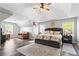 Spacious main bedroom suite with vaulted ceiling, ceiling fan, sitting area, and abundant natural light at 904 Beaumont Ct, Canton, GA 30114