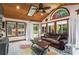 Bright sunroom with wood ceiling, multiple windows, and comfortable seating at 904 Beaumont Ct, Canton, GA 30114