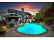 Twilight view of the backyard swimming pool and landscaped yard of this beautiful home at 904 Beaumont Ct, Canton, GA 30114