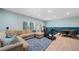 Finished basement boasts a cozy seating area, table for dining, and exercise equipment at 1388 La France Ne St, Atlanta, GA 30307