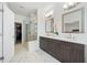 Luxury bathroom featuring a double vanity, glass-enclosed shower, and a modern design at 1388 La France Ne St, Atlanta, GA 30307