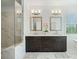 Modern bathroom featuring a double vanity, separate tub and shower, and tile flooring at 1388 La France Ne St, Atlanta, GA 30307