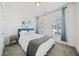 Comfortable bedroom featuring two windows and soft carpeting at 1388 La France Ne St, Atlanta, GA 30307