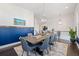 Open-concept dining area with elegant chandelier, dark floors, and an adjacent staircase at 1388 La France Ne St, Atlanta, GA 30307
