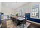 Spacious dining area with a statement chandelier, large windows, and seating for eight at 1388 La France Ne St, Atlanta, GA 30307