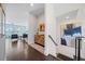 Bright entryway with hardwood floors, modern art, and open access to the living area at 1388 La France Ne St, Atlanta, GA 30307