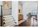 Entryway with hardwood floors and carpeted staircase to the upper level at 1388 La France Ne St, Atlanta, GA 30307