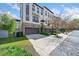 Attractive townhome with a brick and white exterior, two-car garage, and well-maintained landscaping at 1388 La France Ne St, Atlanta, GA 30307