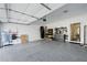 Spacious garage with epoxy flooring, storage, and well-organized tool racks for car enthusiasts at 1388 La France Ne St, Atlanta, GA 30307