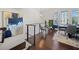 Second floor hallway view of a dining area with a large art piece on the wall at 1388 La France Ne St, Atlanta, GA 30307