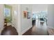 Hallway view of a powder room, dining area, and living room with an open floor plan at 1388 La France Ne St, Atlanta, GA 30307