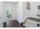Bright hallway features hardwood floors, staircase, and doorway to a home office with natural light at 1388 La France Ne St, Atlanta, GA 30307