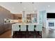 Stylish kitchen with central island, stainless appliances, modern cabinetry, and adjacent living area at 1388 La France Ne St, Atlanta, GA 30307