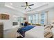 Bright bedroom featuring a ceiling fan, sitting area and natural light at 1388 La France Ne St, Atlanta, GA 30307