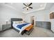 Well-lit main bedroom with a ceiling fan, bed, and sitting area with lots of natural light at 1388 La France Ne St, Atlanta, GA 30307