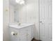 Bathroom with vanity featuring gold hardware, a sink, and storage; a mirror enhances space at 488 Takely Dr, Lawrenceville, GA 30046