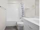 The bathroom has a shower with curtain, toilet and vanity with sink offering a relaxing space at 488 Takely Dr, Lawrenceville, GA 30046