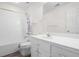 Clean bathroom features a shower, a vanity with a white sink and a toilet for daily convenience at 488 Takely Dr, Lawrenceville, GA 30046