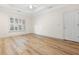 Spacious bedroom featuring a tray ceiling, ceiling fan and a large window at 488 Takely Dr, Lawrenceville, GA 30046