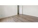Bright, spacious bedroom features hardwood floors, a closet and neutral paint providing a serene feel at 488 Takely Dr, Lawrenceville, GA 30046