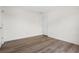 Clean and simple bedroom with hardwood floors and a white door for a minimalist feel at 488 Takely Dr, Lawrenceville, GA 30046