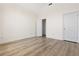 Bedroom with luxury vinyl plank flooring, one closet and two doors at 488 Takely Dr, Lawrenceville, GA 30046