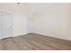 Bedroom with luxury vinyl plank flooring, two closets and two doors at 488 Takely Dr, Lawrenceville, GA 30046