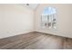 Spacious bedroom features a large window and luxury vinyl plank flooring at 488 Takely Dr, Lawrenceville, GA 30046