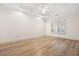 Spacious bedroom features a tray ceiling, recessed lighting, and a large window at 488 Takely Dr, Lawrenceville, GA 30046