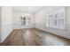 Dining room featuring wainscoting, hardwood floors, and natural light at 488 Takely Dr, Lawrenceville, GA 30046