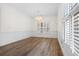 Dining room featuring wainscoting, hardwood floors, and natural light at 488 Takely Dr, Lawrenceville, GA 30046