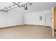 Spacious garage with two white doors and an overhead garage door at 488 Takely Dr, Lawrenceville, GA 30046