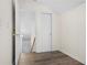 Hallway with wood floor and a white door leading to the staircase at 488 Takely Dr, Lawrenceville, GA 30046
