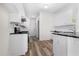 Kitchen with stainless steel appliances, white cabinets and granite countertops at 488 Takely Dr, Lawrenceville, GA 30046