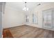 Bright living room with natural light, modern flooring, and access to the outdoors at 488 Takely Dr, Lawrenceville, GA 30046