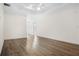 Open living room with wood floors, white walls, and recessed lighting at 488 Takely Dr, Lawrenceville, GA 30046