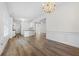 Spacious living room with wood floors, white walls, and modern chandelier at 488 Takely Dr, Lawrenceville, GA 30046