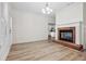 Comfortable living room with a brick fireplace, ample natural light, and neutral decor at 488 Takely Dr, Lawrenceville, GA 30046