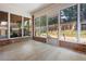 Enclosed sunroom or patio with access to deck and backyard at 488 Takely Dr, Lawrenceville, GA 30046