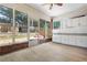 Inviting sunroom featuring large windows and a sink, perfect for relaxation and hobbies at 488 Takely Dr, Lawrenceville, GA 30046