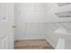 Spacious walk-in closet with white wire shelving and durable light-colored wood flooring at 488 Takely Dr, Lawrenceville, GA 30046
