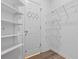 Bright walk-in closet with white shelving and racks for optimal organization at 488 Takely Dr, Lawrenceville, GA 30046
