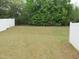 Large backyard is enclosed by a white privacy fence at 5815 Mountain Top Pl, Cumming, GA 30041