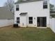 View of the back of the home with sliding glass doors and a fenced-in yard at 5815 Mountain Top Pl, Cumming, GA 30041