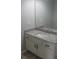Bathroom vanity features white cabinets and a granite countertop at 5815 Mountain Top Pl, Cumming, GA 30041