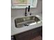 Stainless steel kitchen sink with modern fixtures and quartz countertop at 1427 Lorenzo Sw Dr, Atlanta, GA 30310