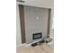 Modern living room featuring a tiled fireplace with a sleek, built-in electric firebox at 1427 Lorenzo Sw Dr, Atlanta, GA 30310