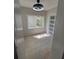 Modern room with natural light and sliding barn door featuring frosted glass panels at 1427 Lorenzo Sw Dr, Atlanta, GA 30310